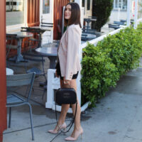 blush blazer and black outfit